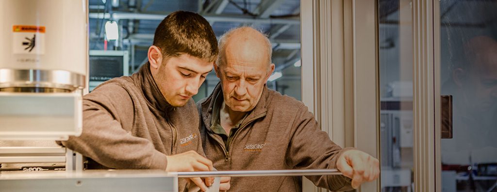 assembly technicians working on a machine
