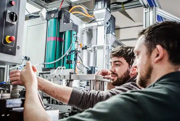 engineers reviewing RNA feed system